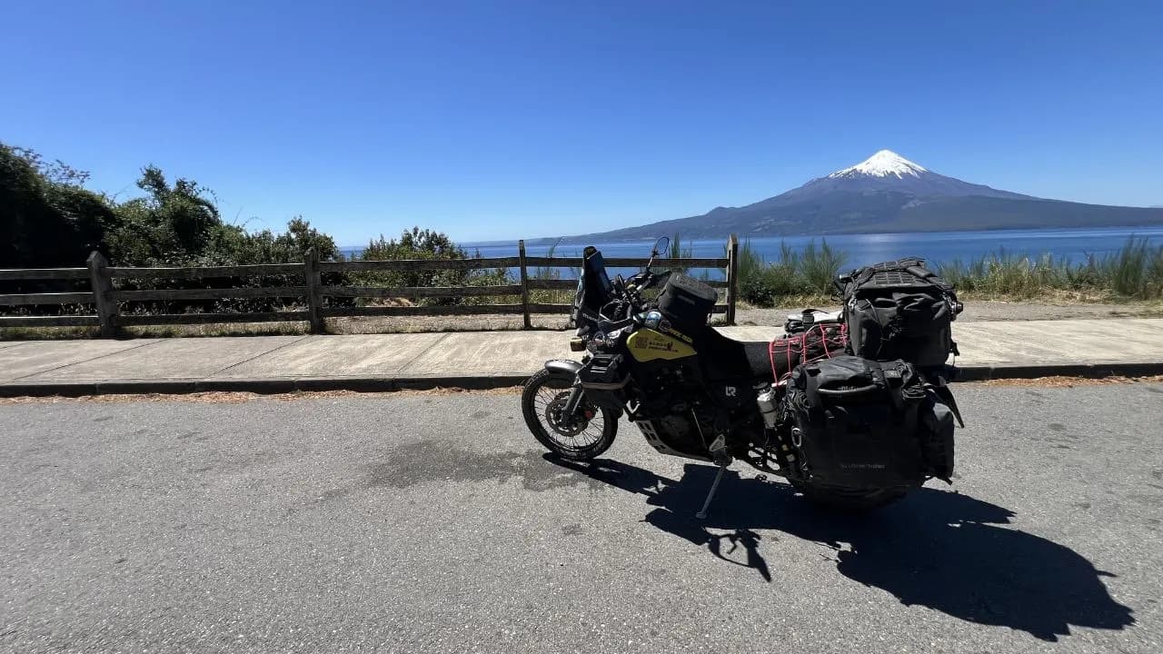 Motorcycle next to Osorno Volcano and Lake Llanquihue