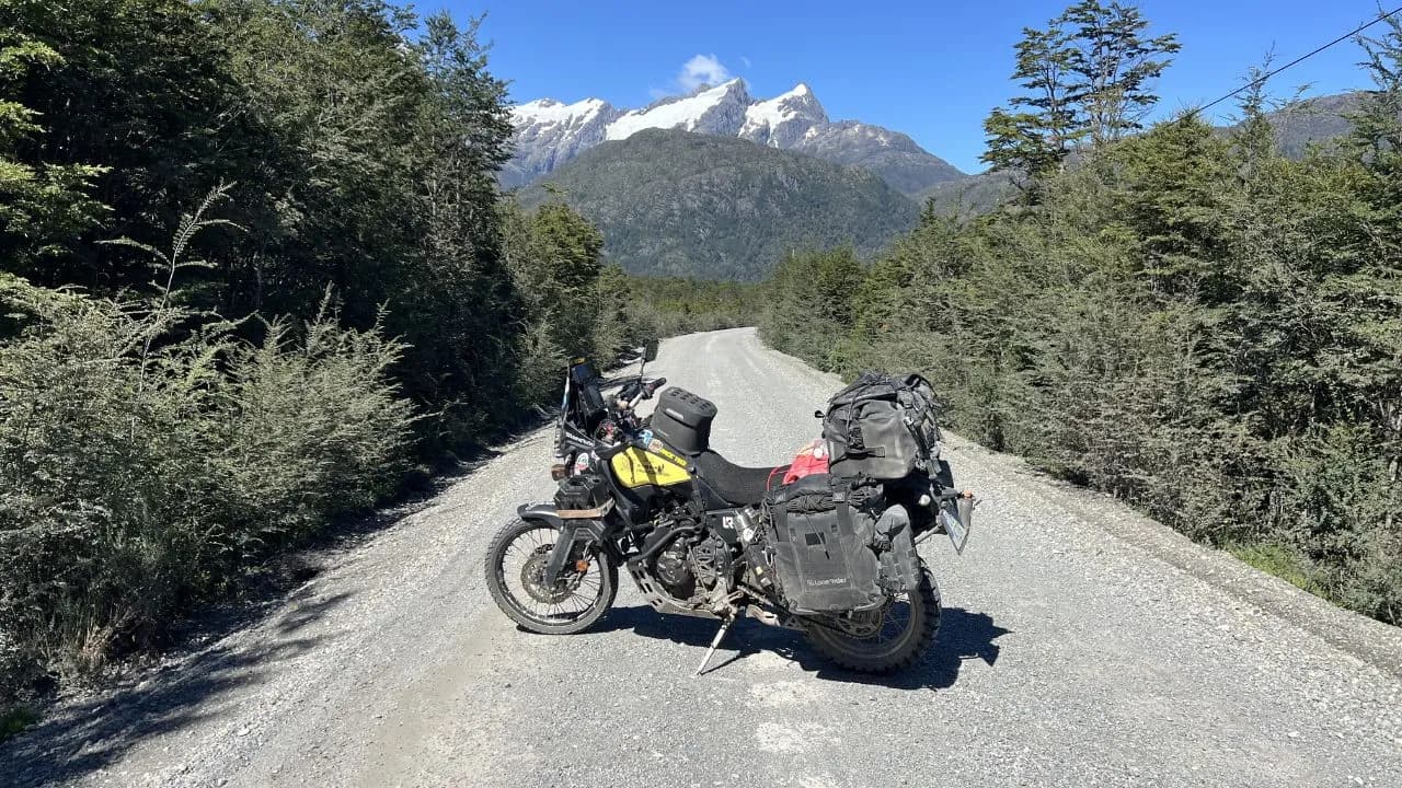 Motorcycle on a gravel road crossing the cold rainforest of the Carretera Austral