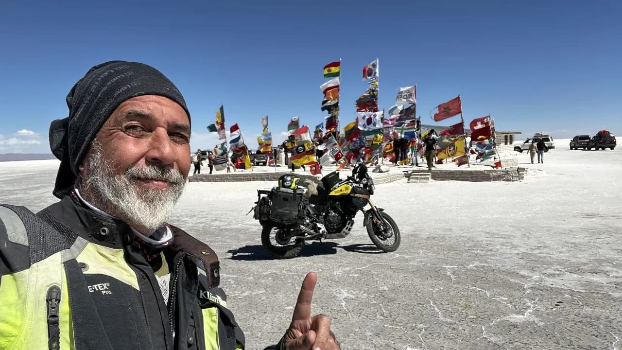 Gustavo Correa with his motorcycle on the Salar de Uyuni, Bolivia - South America trip