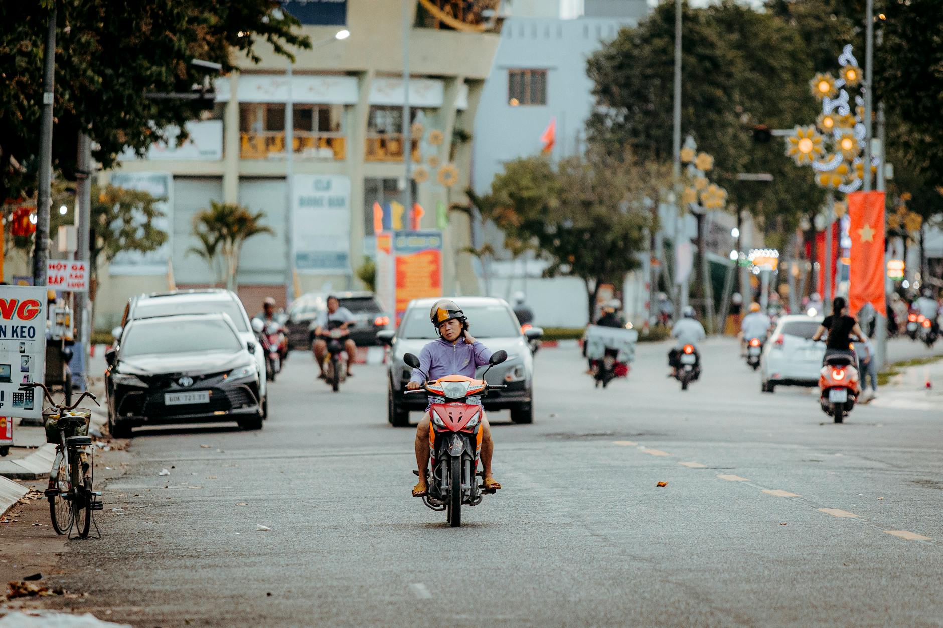 urban street scene with motorbike and traffic