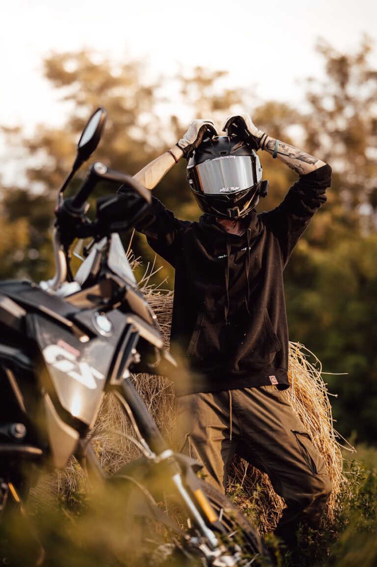 motorcyclist with helmet in outdoor setting
